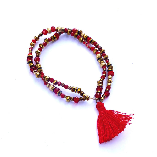 Bracelet élastique double perles et pompon rouge