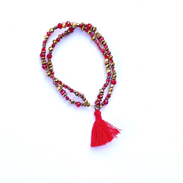 Bracelet élastique double perles et pompon rouge