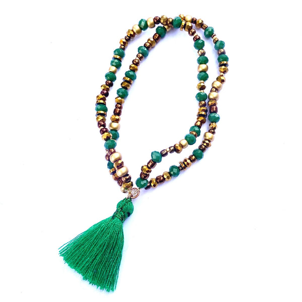 Bracelet élastique double perles et pompon vert