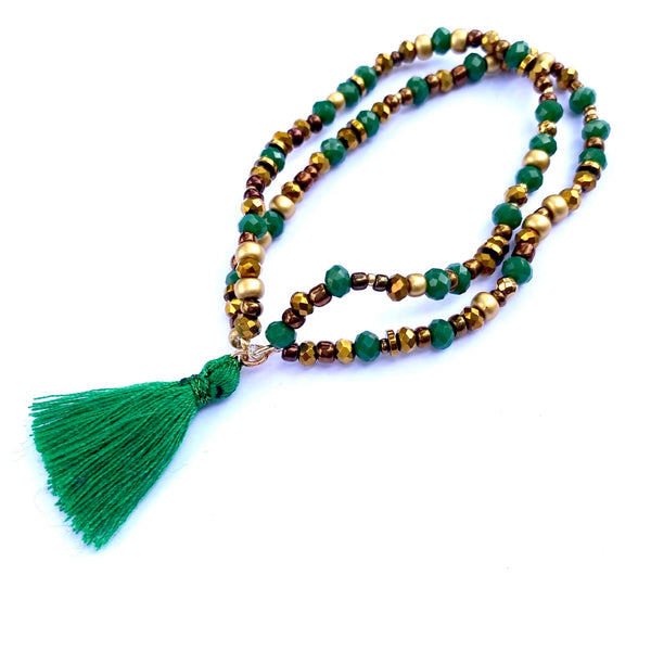 Bracelet élastique double perles et pompon vert