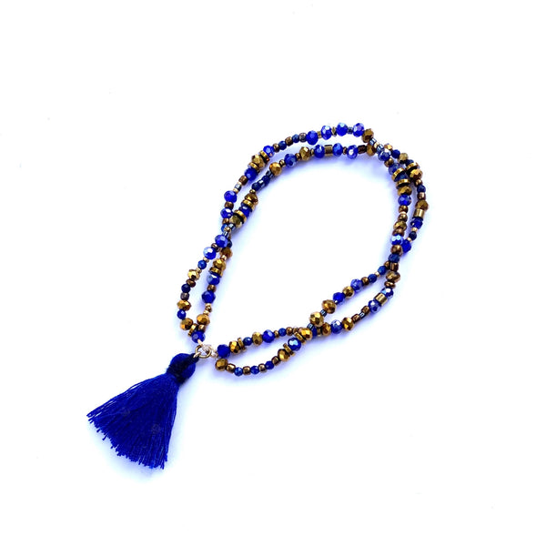 Bracelet élastique double perles et pompon marine