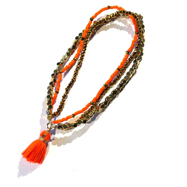 Bracelet pompon orange fluo