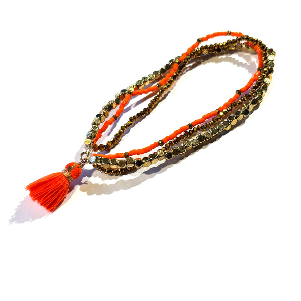 Bracelet pompon orange fluo