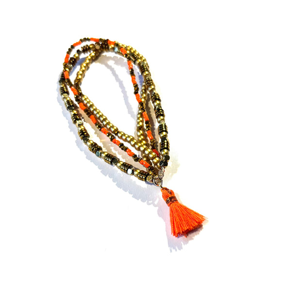 Bracelet pompon orange fluo
